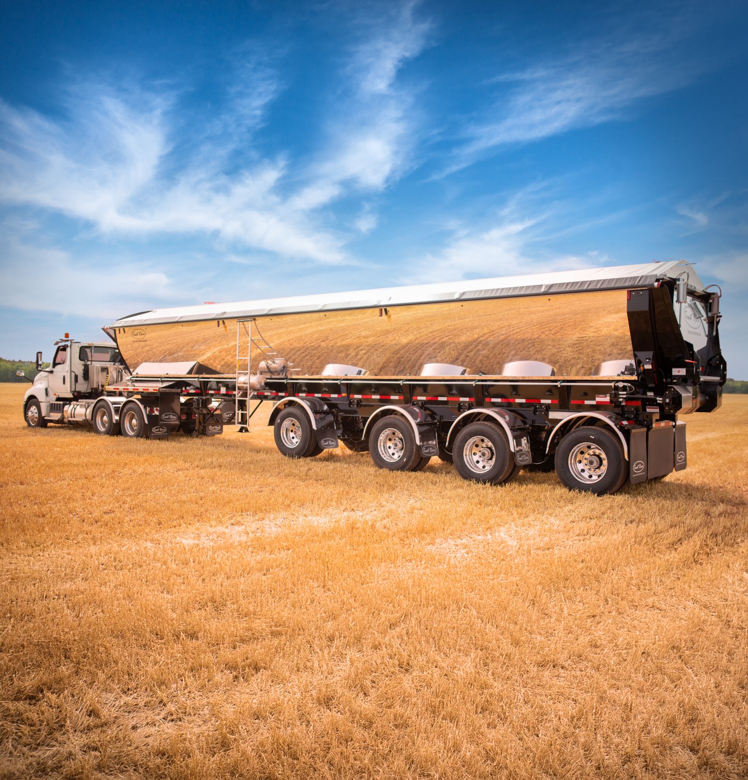 Live Bottom Trailer in a Field